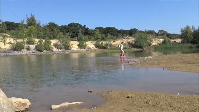 Poster: Wearing Red Hunter Wellies In The Water