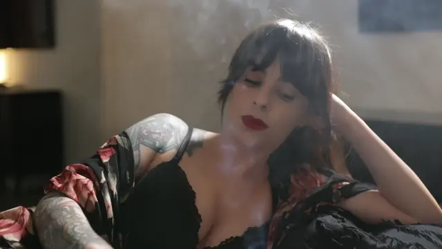 Poster: Smoking Vss in Black Bra and Cover Up